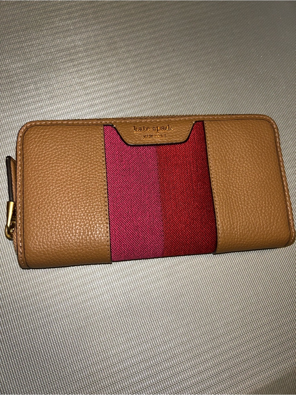 kate spade tan wallet with pink and red center stripe